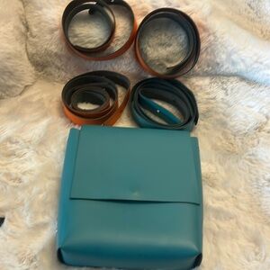 HEMINCUFF teal blue origami bag with 4 straps